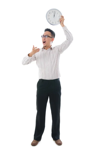 Asiático hombre de negocios celebración de un reloj — Foto de Stock