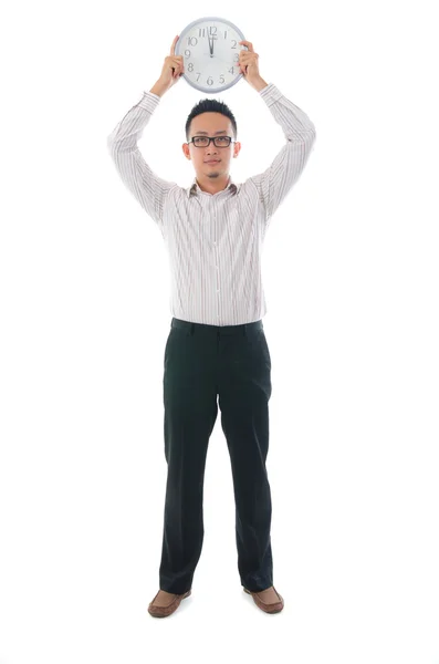 Asian business man holding a clock — Stock Photo, Image