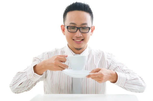 Asian business man drinking coffee — Stock Photo, Image