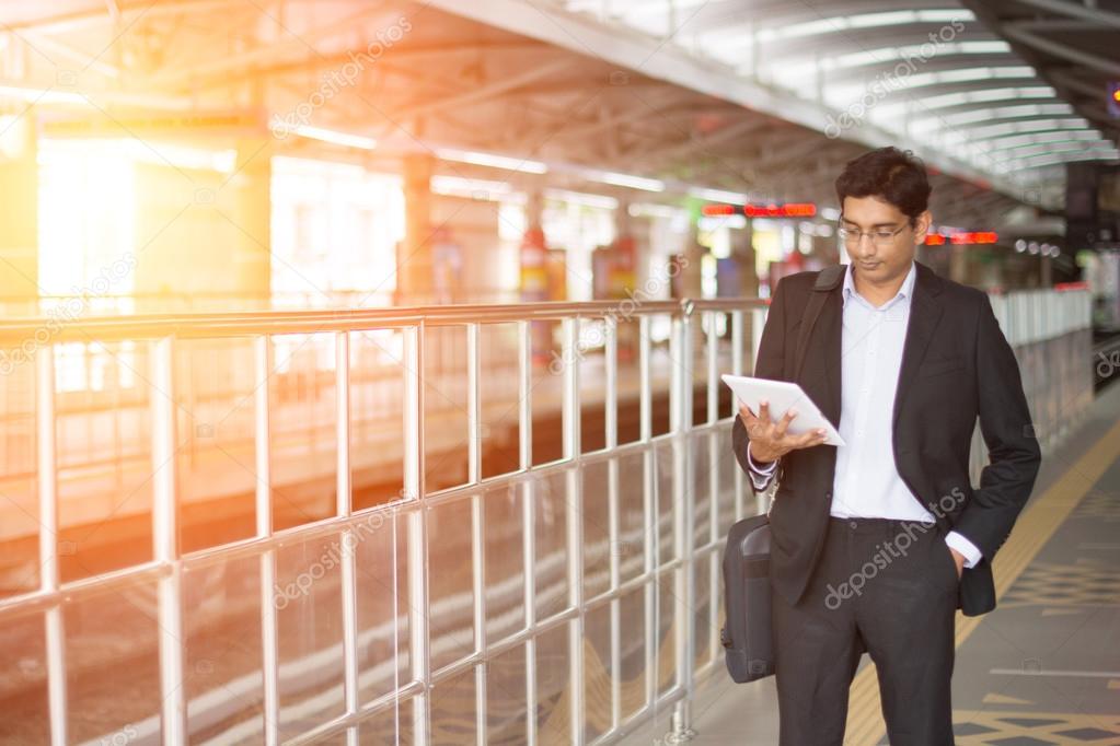 indian business man using tablet