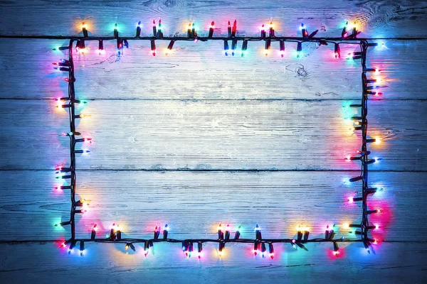 Marco de madera colorido de la guirnalda de las luces, signo de luz de color navideño — Foto de Stock