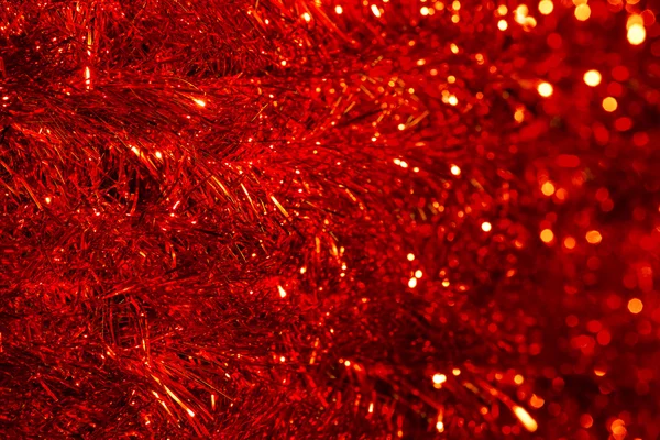 Tinsel γιρλαντών αφηρημένη διακόσμηση υποβάθρου, κόκκινα φώτα Defocused, — Φωτογραφία Αρχείου