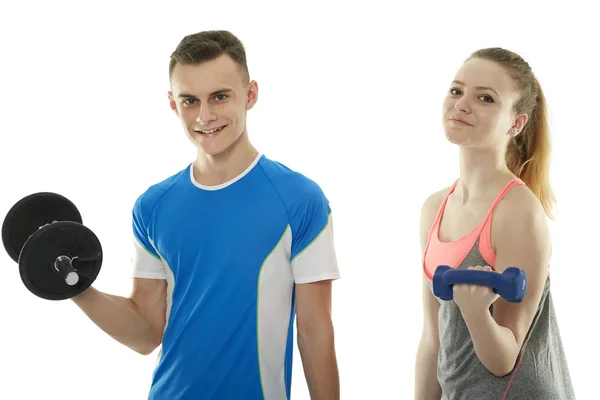 Teenagers working out with dumbbells — Stock Photo, Image