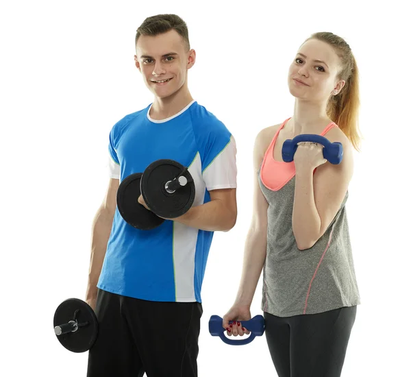 Teenagers working out with dumbbells — Stock Photo, Image