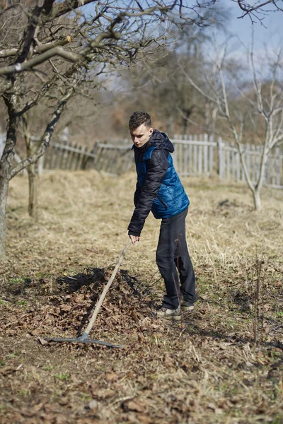 Teenage farmer on spring cleaning — Stock Photo, Image