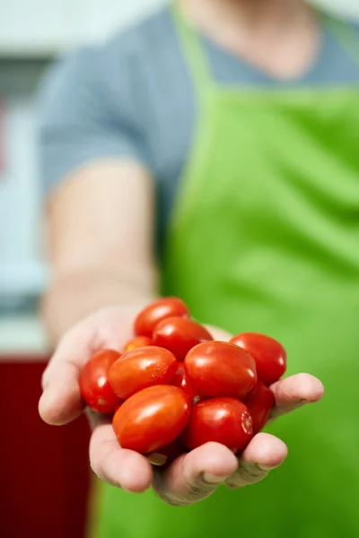 Chef holding cherry tomatoes — Stock Photo, Image