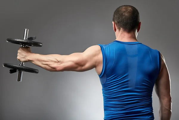 Man doing shoulder workout — Stock Photo, Image