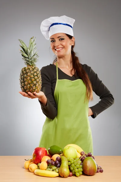 Mujer cocinera con frutas Imagen de stock