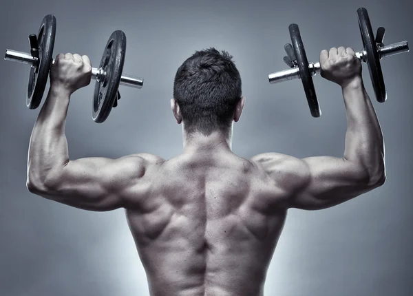 Man doing shoulders workout — Stock Photo, Image