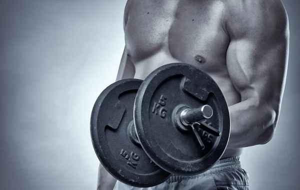 Athlete doing biceps curl — Stock Photo, Image