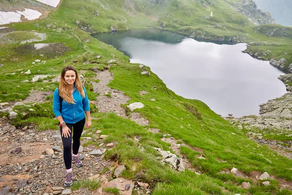 Hiker  in rocky mountains — Stock Photo, Image