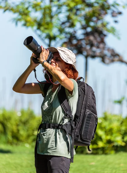 Nature photographer with her camera — Stock Photo, Image