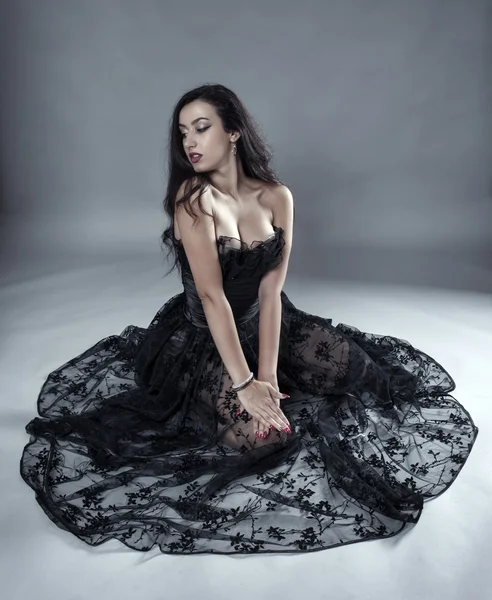 Model in black lace dress posing — Stock Photo, Image