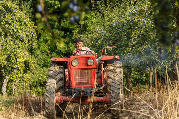  farmer on  tractor with  trailer