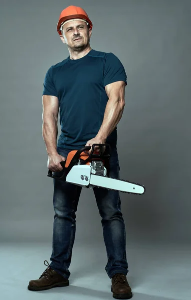 Worker Hardhat Holding Chainsaw Medium Size — Stock Photo, Image