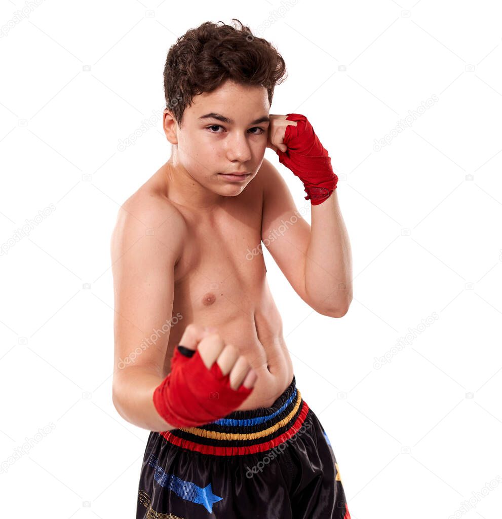 Young kickboxer training shadow boxing, isolated on white background