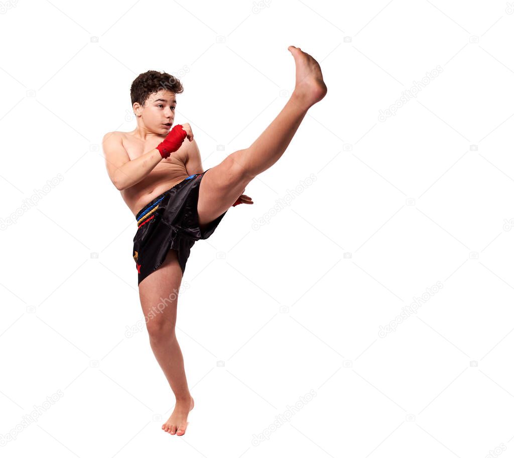 Young kickboxer training shadow boxing, isolated on white background