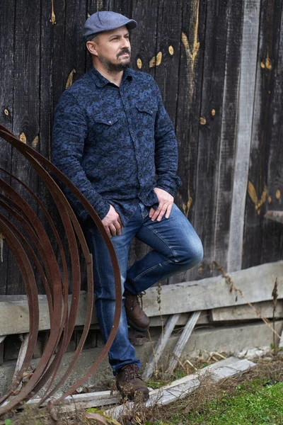 Full Length Middle Aged Man Blue Jeans Shirt Cap Leaning — Stock Photo, Image