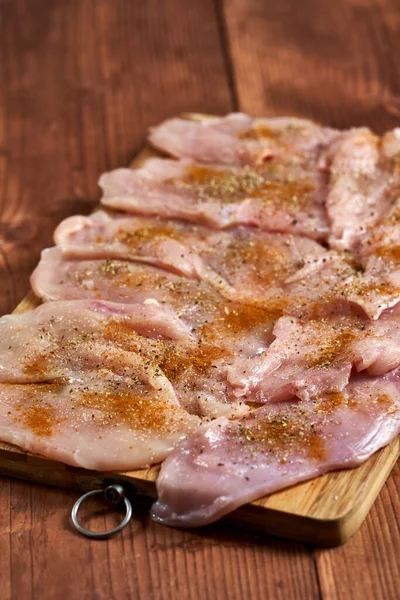 Seasoned Chicken Breast Fillets Wooden Board Closeup — Stock Photo, Image