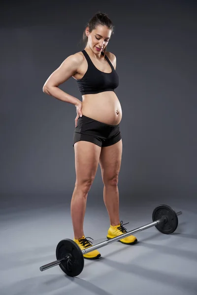Young Pregnant Woman Doing Fitness Exercise Studio Shot Gray Background — Stock Fotó