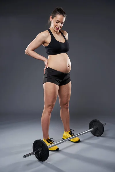 Young Pregnant Woman Doing Fitness Exercise Studio Shot Gray Background — Fotografia de Stock