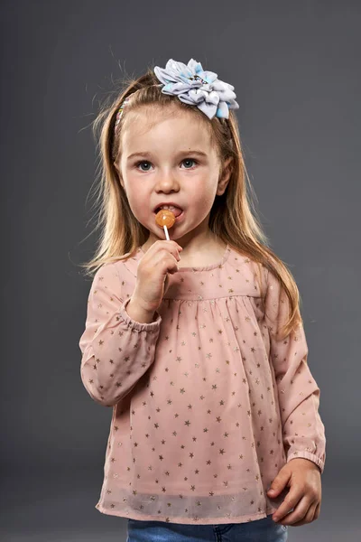 Little Blond Girl Savouring Lollipop Closeup Shot Isolated Gray Background — Stock Photo, Image