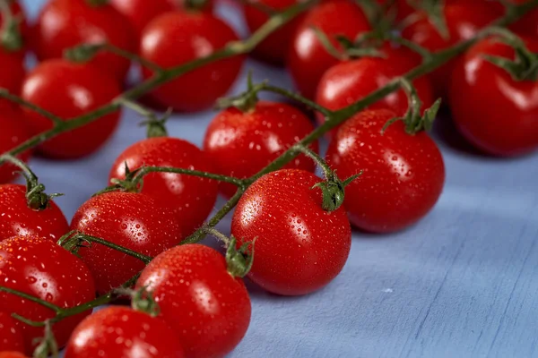 Closeup Italian Cherry Tomatoes Dew Them Blue Wooden Board — Stock Photo, Image