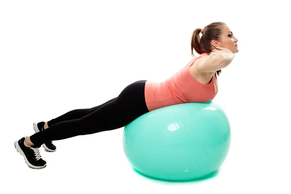 Entrenamiento de espalda en una pelota de gimnasio —  Fotos de Stock