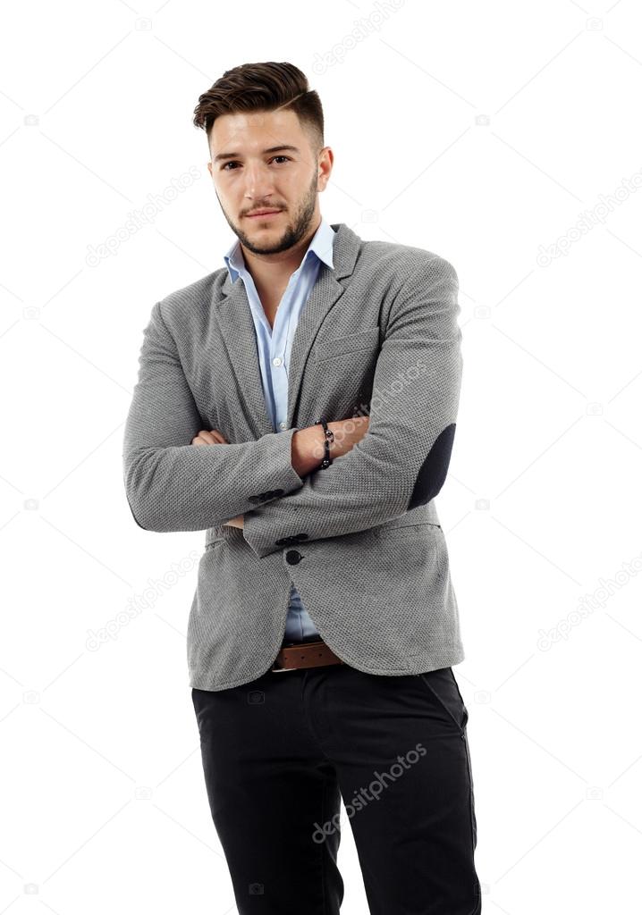 Young businessman with arms folded