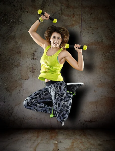 Young woman with dumbbells — Stock Photo, Image