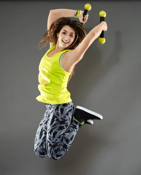 Young woman with dumbbells — Stock Photo, Image