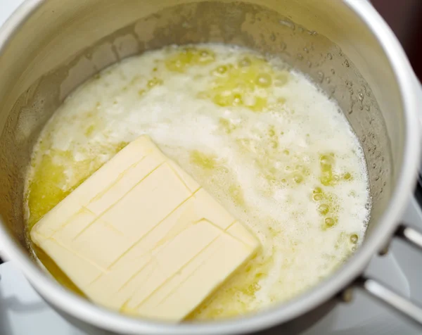 Stick of butter melting — Stock Photo, Image