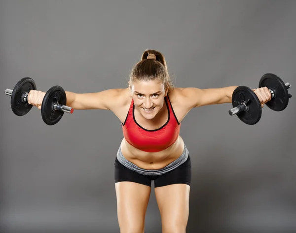Fitness girl working with weights — Stock Photo, Image
