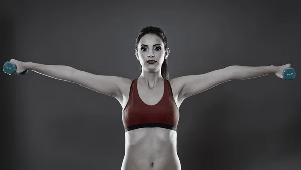 Fitness lady training with dumbbells — Stock Photo, Image