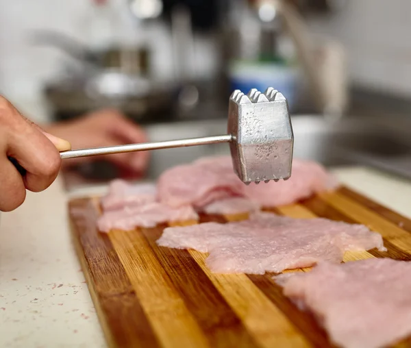 Lady cook making viennese schnitzel — Stock Photo, Image