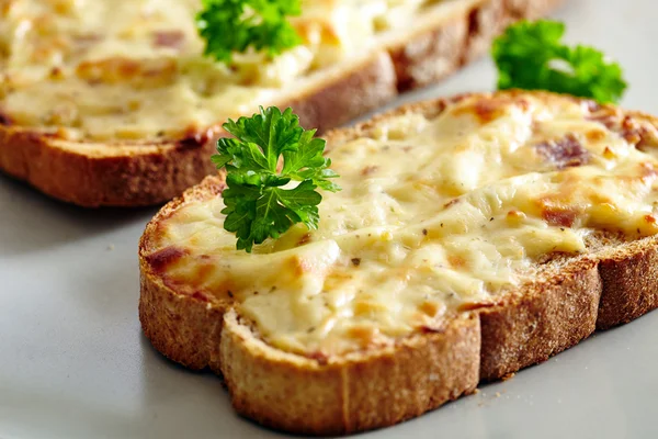 Oven baked toast with cheese and ham — Stock Photo, Image