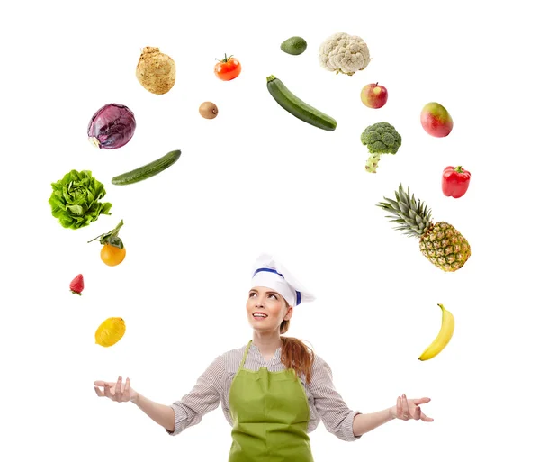 Woman cook juggling with fruits and vegetables — Stock Photo, Image