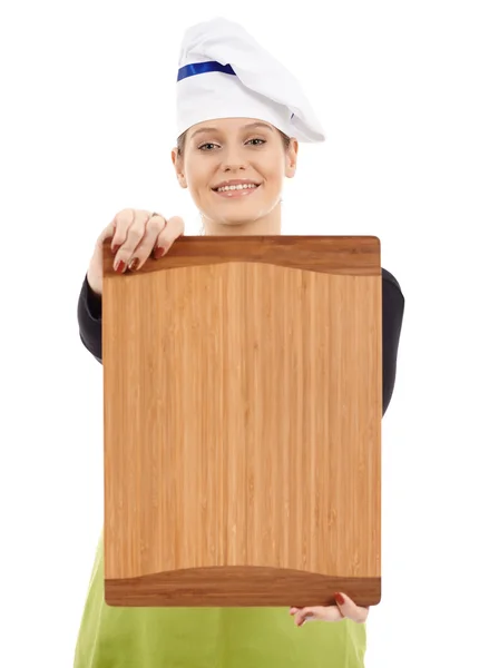 Vrouw cook tonen een houten plank — Stockfoto