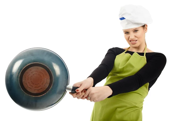 Furious woman cook hitting with the frying pan — Stock Photo, Image