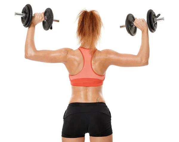 Young fit woman working out with dumbbells — Stock Photo, Image