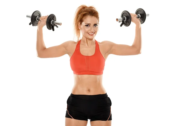 Young fit woman working out with dumbbells — Stock Photo, Image