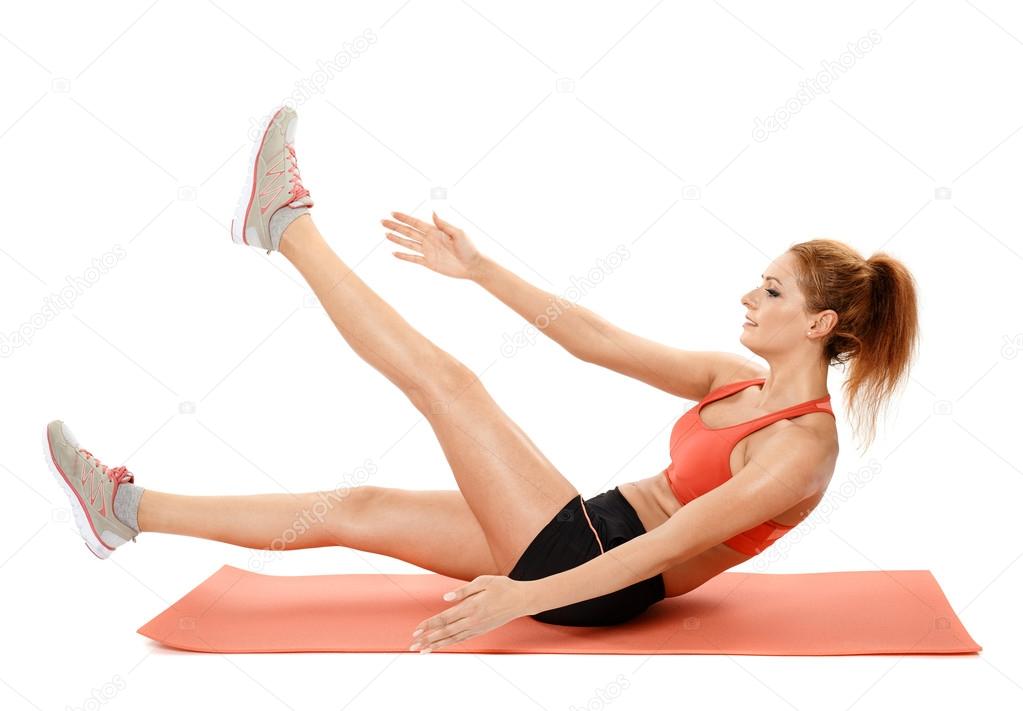 Woman doing exercises on a mat
