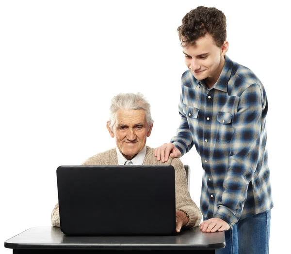 Teen with his granddad at laptop — Stock Photo, Image