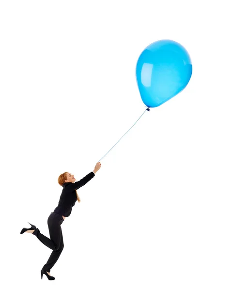 Podnikatelka, chytit létající balón — Stock fotografie
