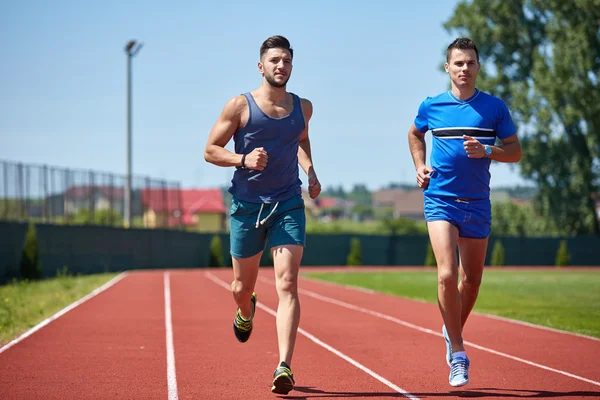 Two friends running — Stock Photo, Image