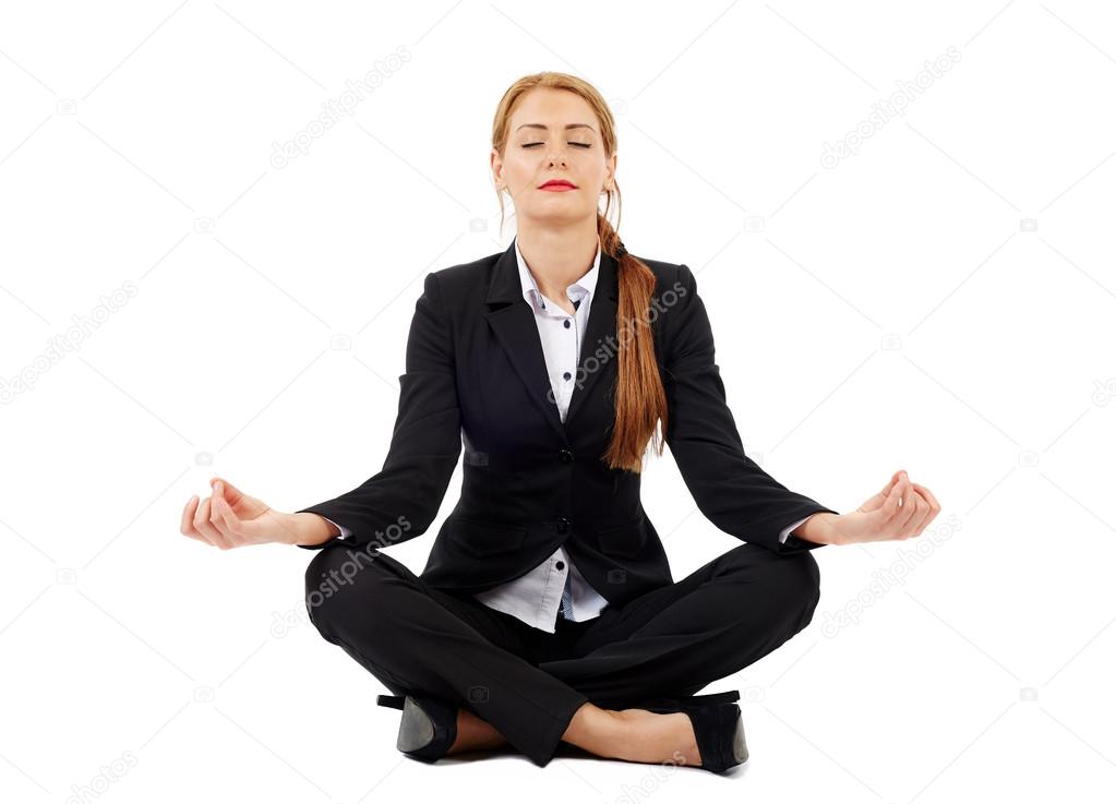 businesswoman sitting in lotus position