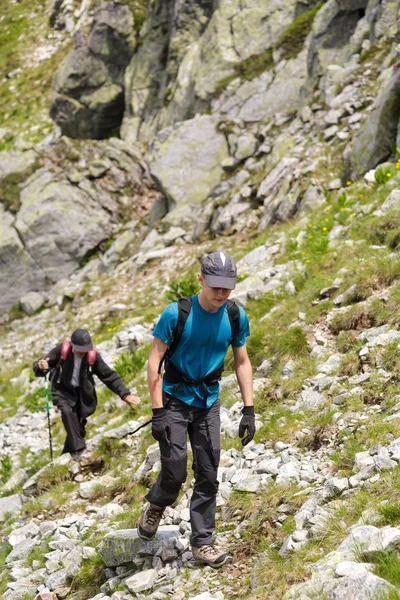 Grandfather and grandson hiking — Stock Photo, Image