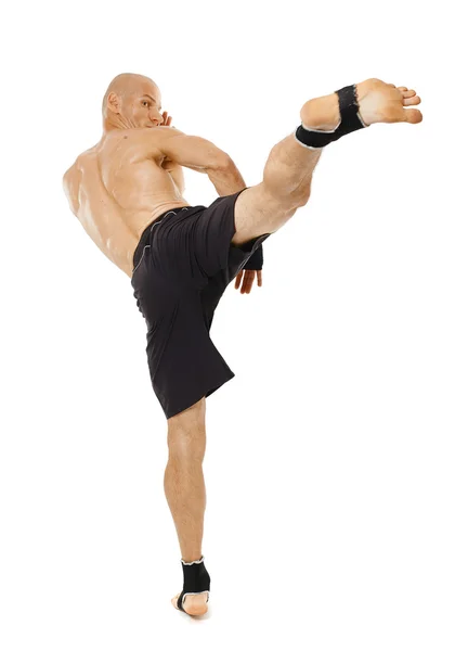 Kickboxer executing a powerful kick — Stock Photo, Image