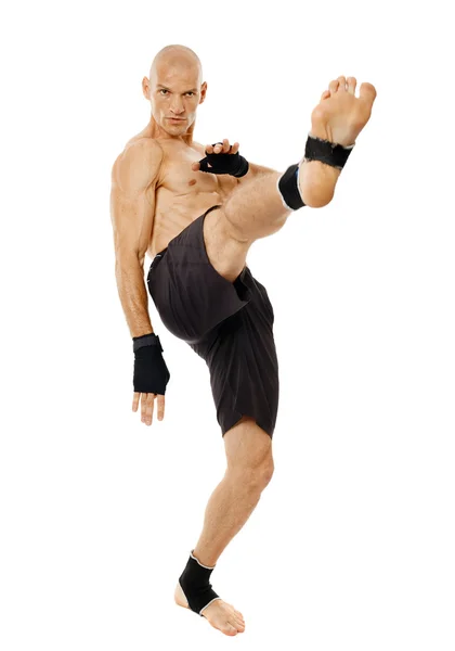 Kickboxer executing a powerful kick — Stock Photo, Image