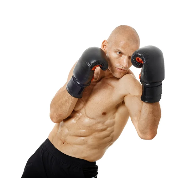 Very fit kickboxer punching — Stock Photo, Image